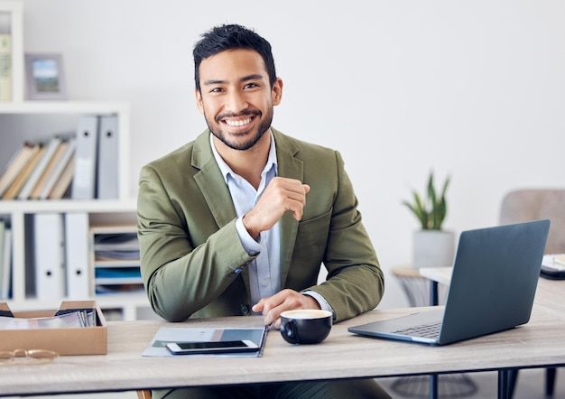 Business professional working at a desk with a laptop